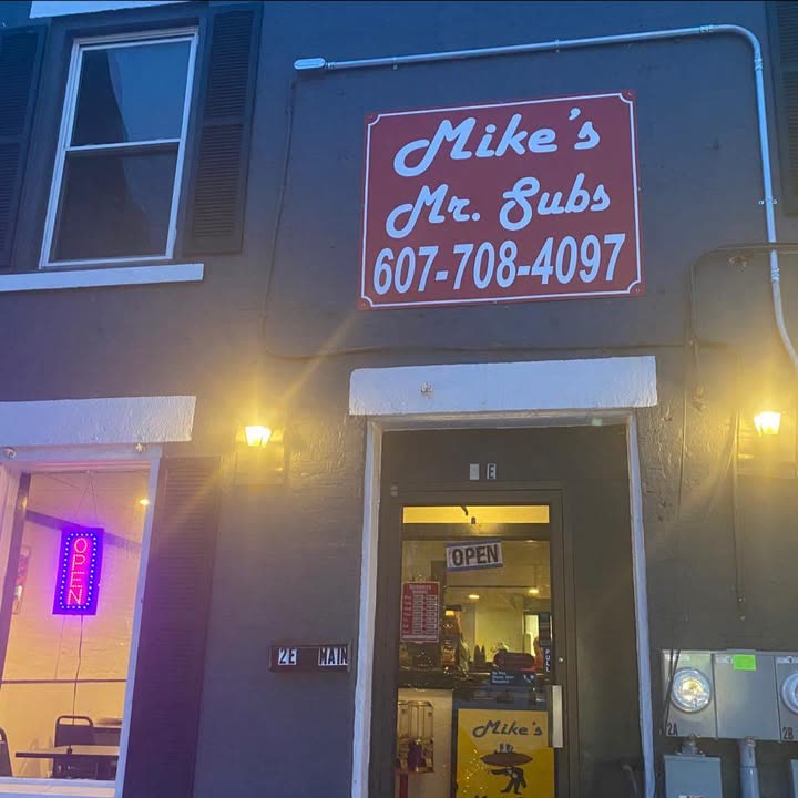 Mike's Mr. Subs storefront sign and entrance at night